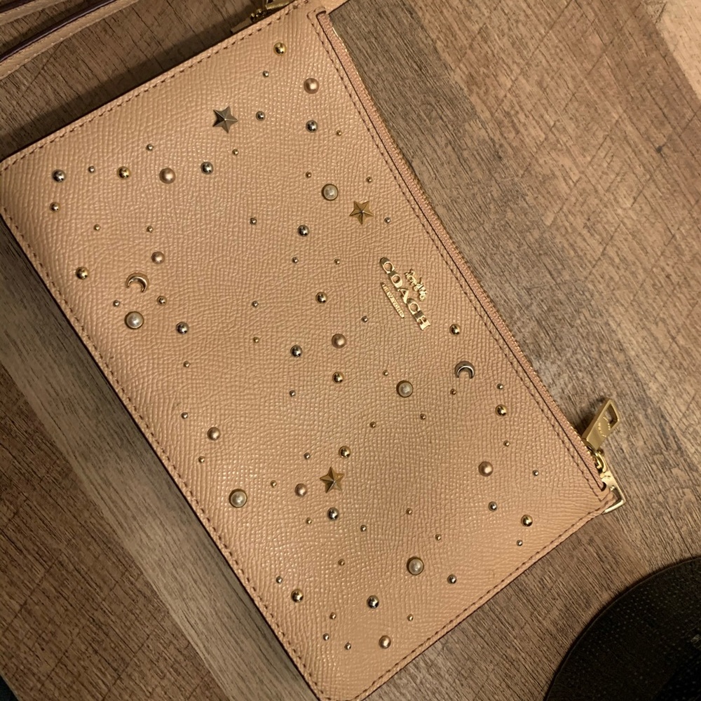 Star studded and pearl Coach Wristlef
